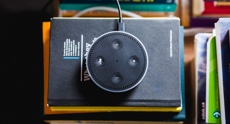 black Amazon Echo on black covered book